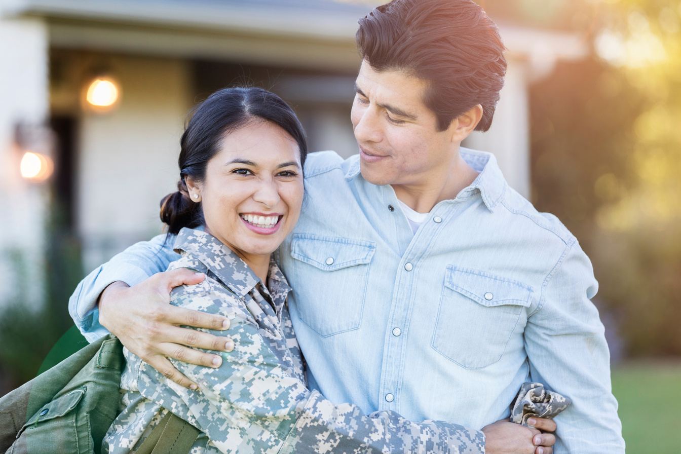 Portrait of couple during military wife's homecoming