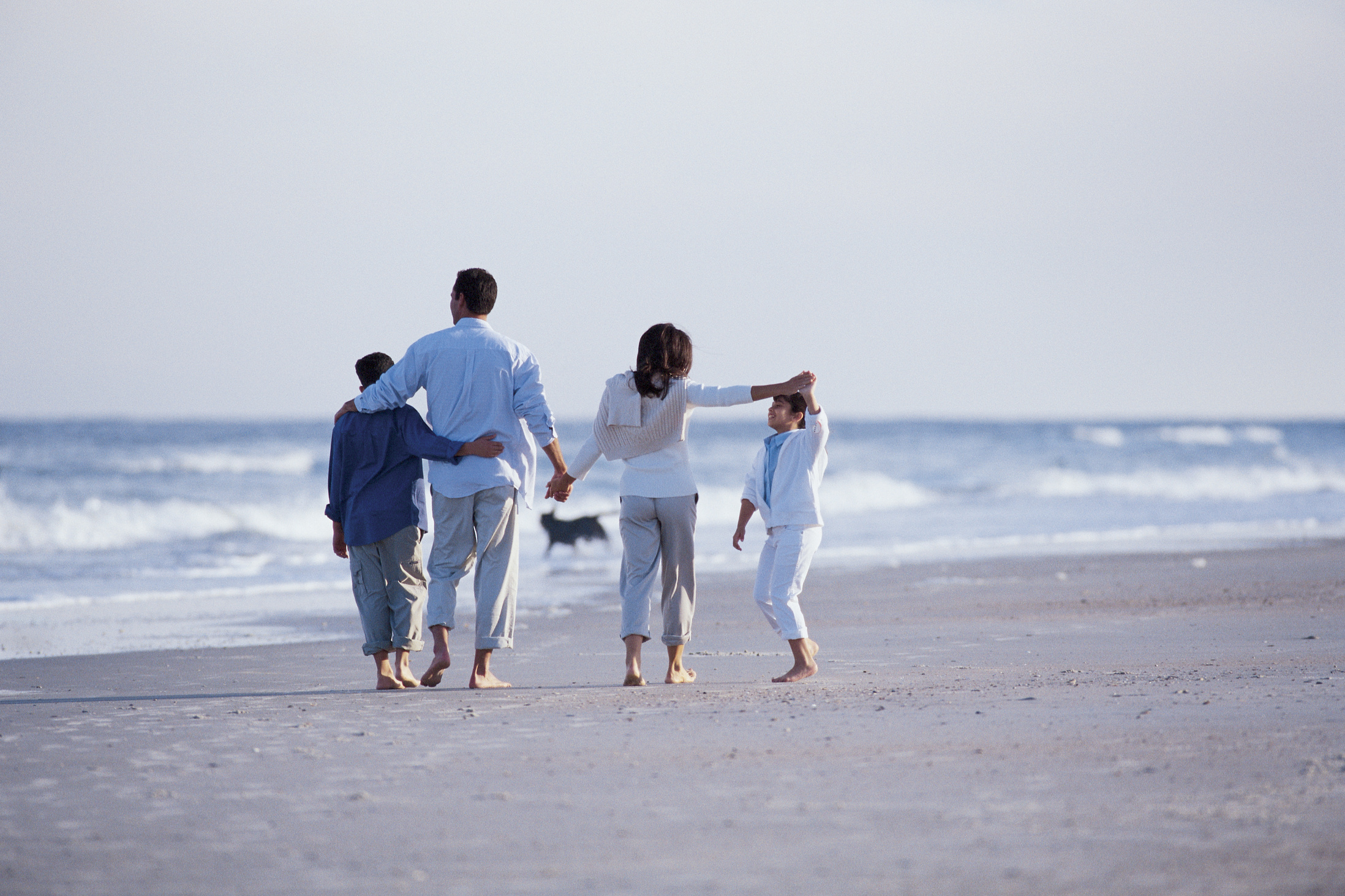Family walking on beach