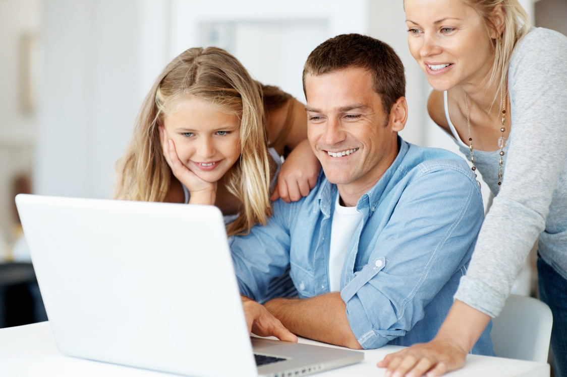 Family using laptop computer